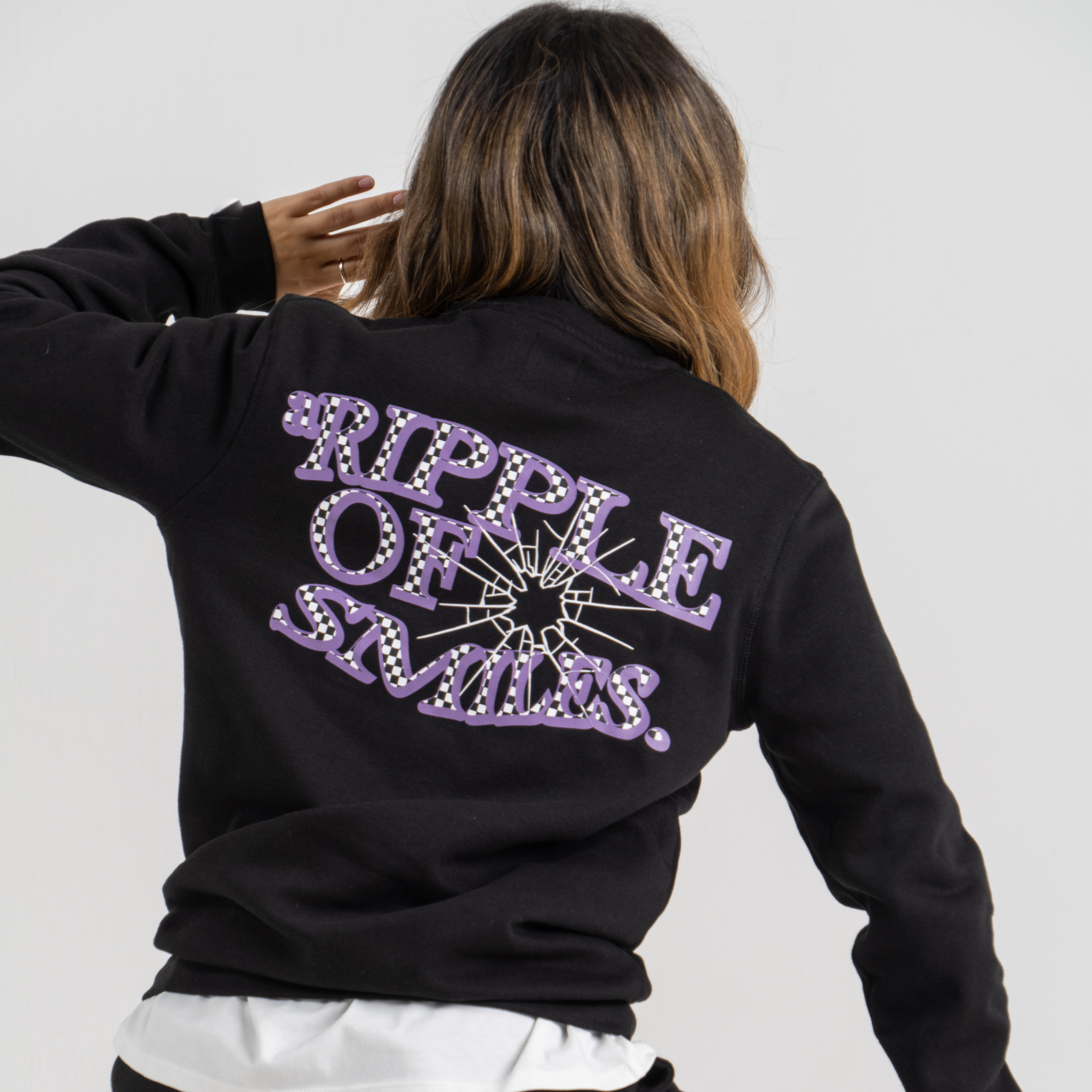 Woman Back wearing black sweater SU1 clothing brand