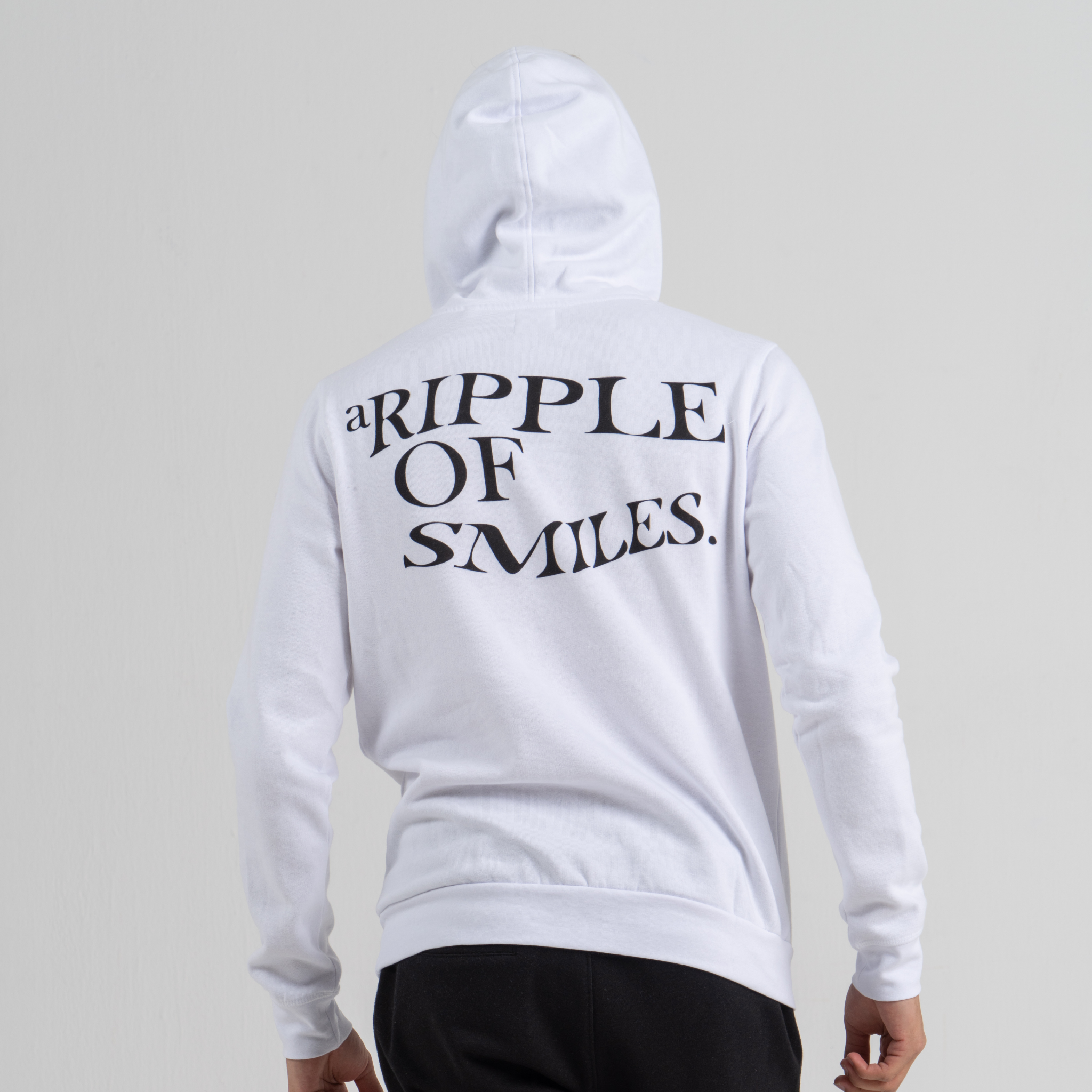 Man back wearing white hoodie SU1 clothing brand