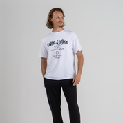 Man wearing white tshirt SU1 brand clothing