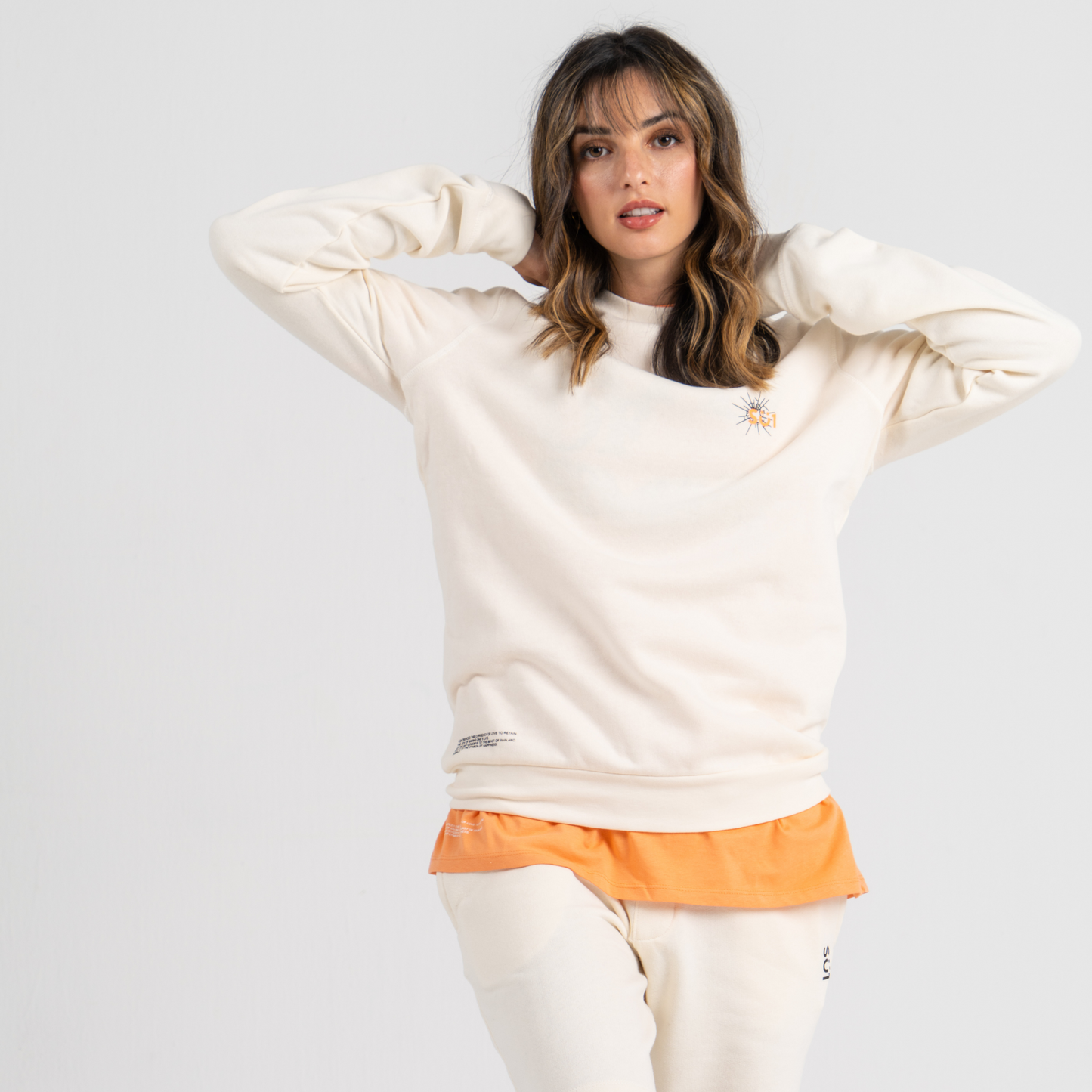 Woman wearing ecru sweater SU1 clothing brand 