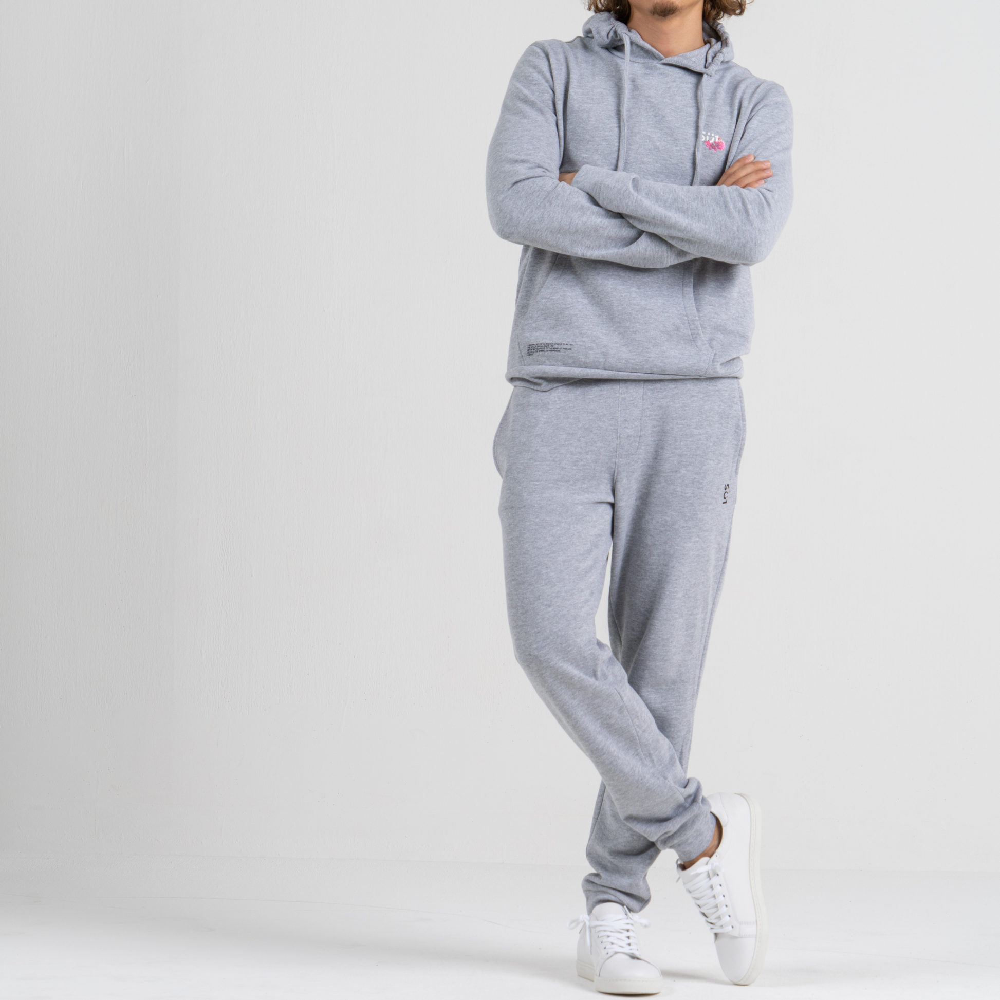 Man wearing grey sport trousers SU1 clothing brand