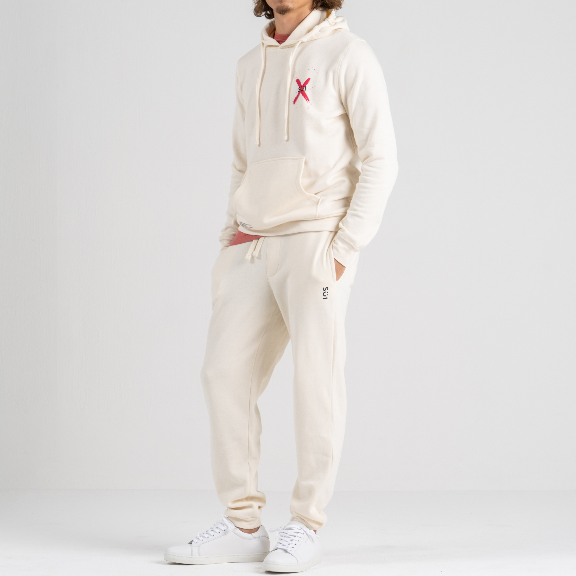 Man wearing ecru sport trousers SU1 clothing brand