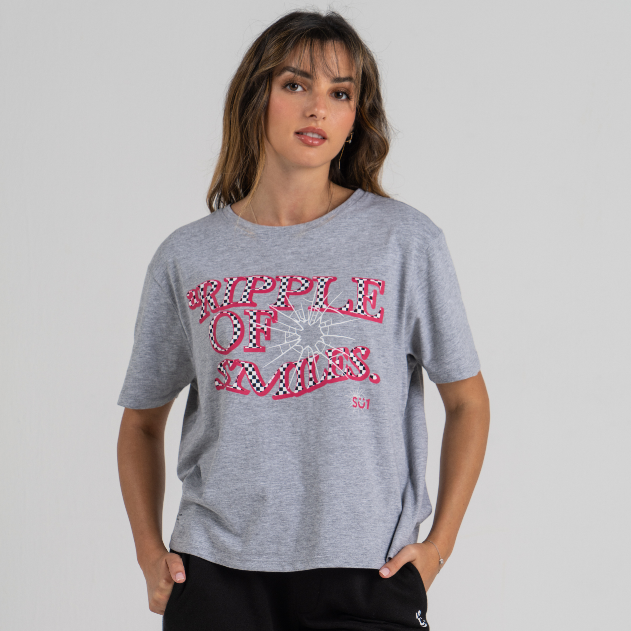 Woman wearing mid crop tshirt grey SU1 clothing brand