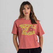 Woman wearing mid crop tshirt pink SU1 clothing brand