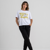 Woman wearing mid crop tshirt white SU1 clothing brand