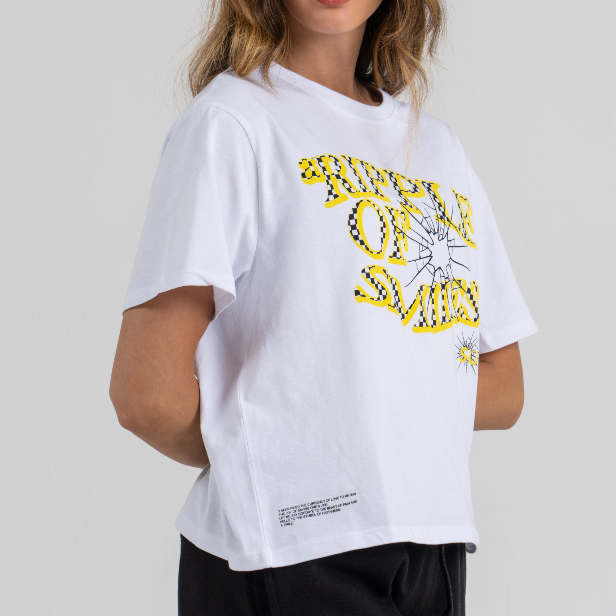 Woman wearing mid crop tshirt white SU1 clothing brand