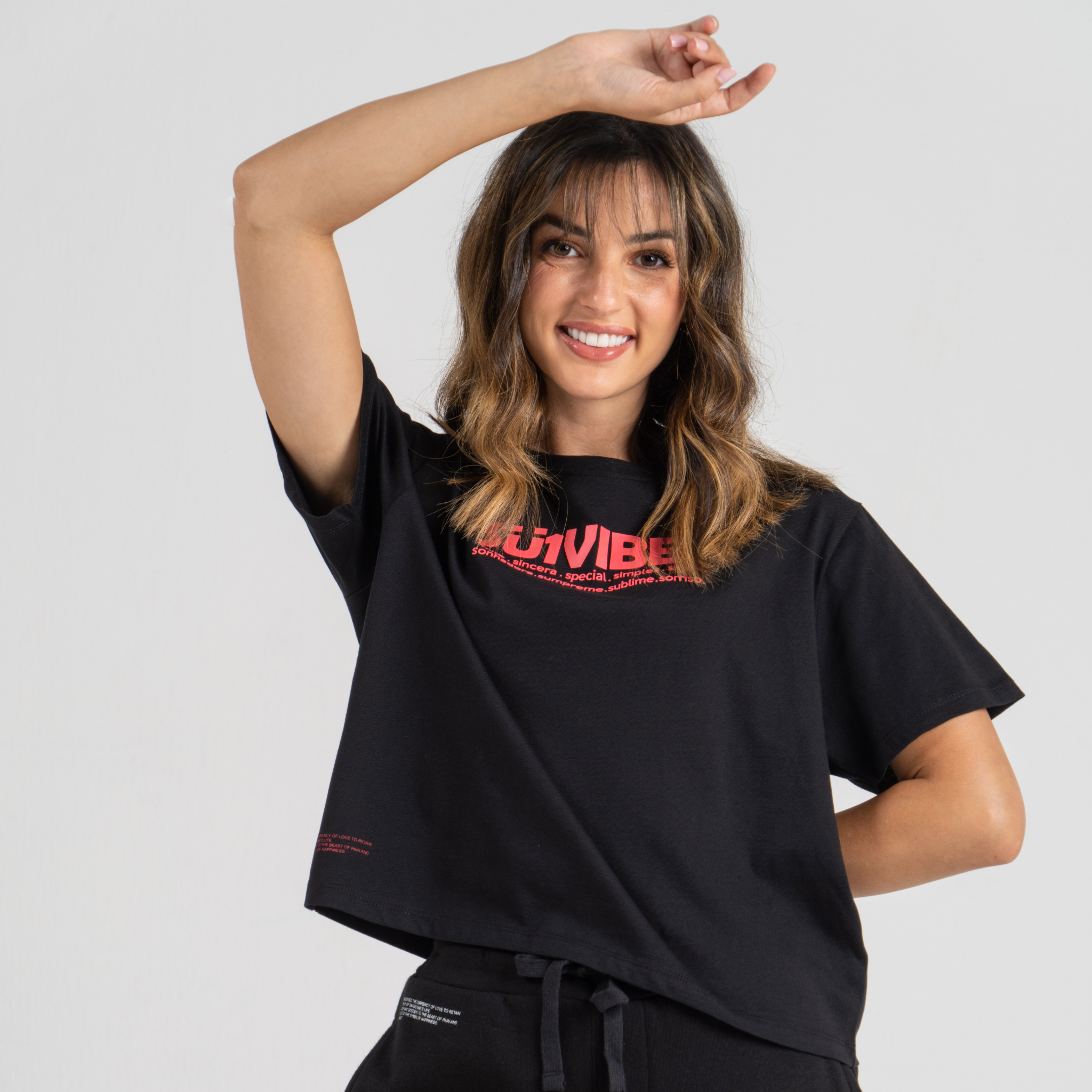 Woman wearing black tshirt mid crop SU1 Brand clothing