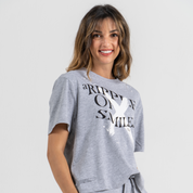 Woman wearing grey tshirt mid crop SU1 clothing brand 