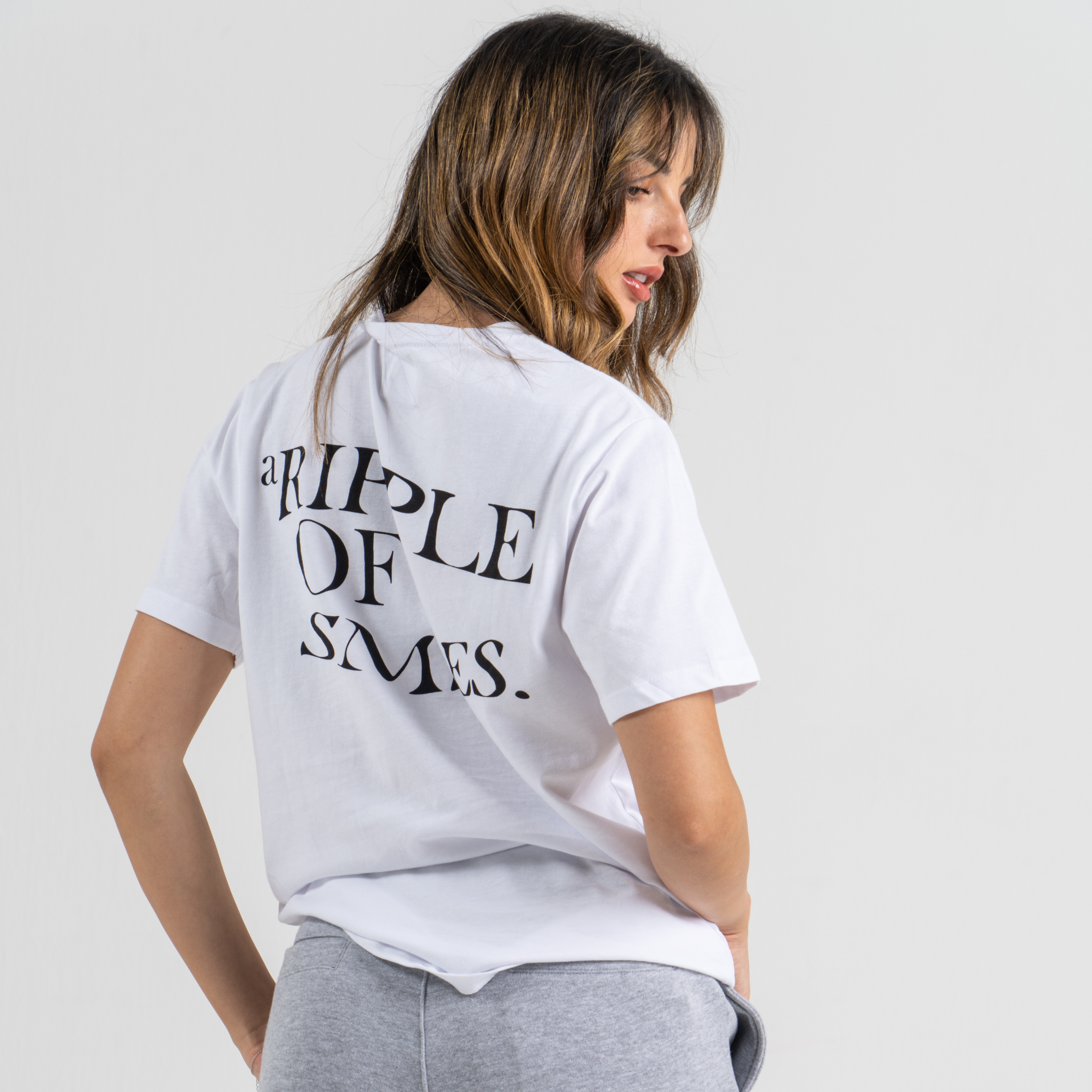 Woman back wearing regular white T-shirt SU1 Brand Clothing